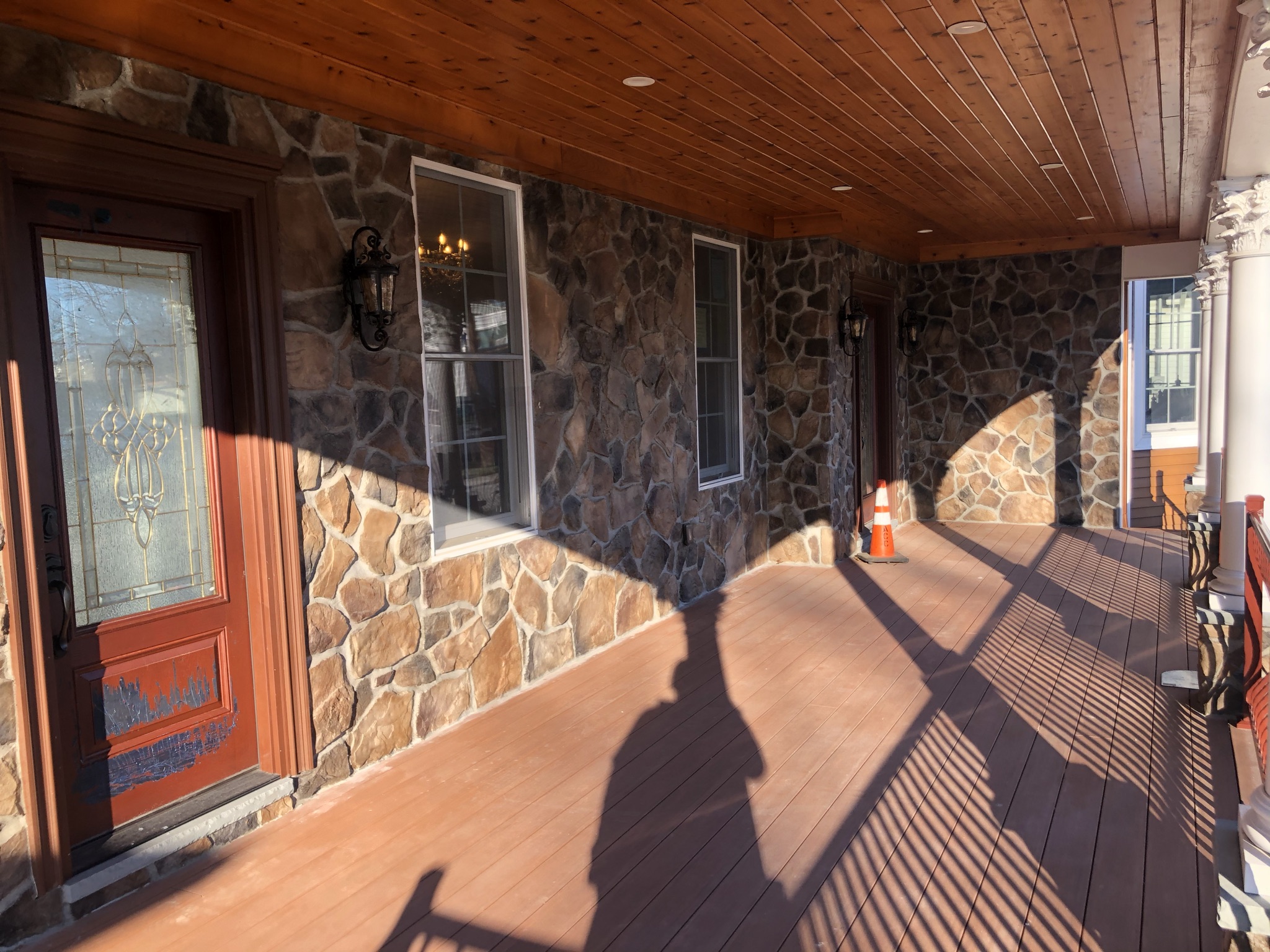 Another View of Stone Lined exterior wall with windows