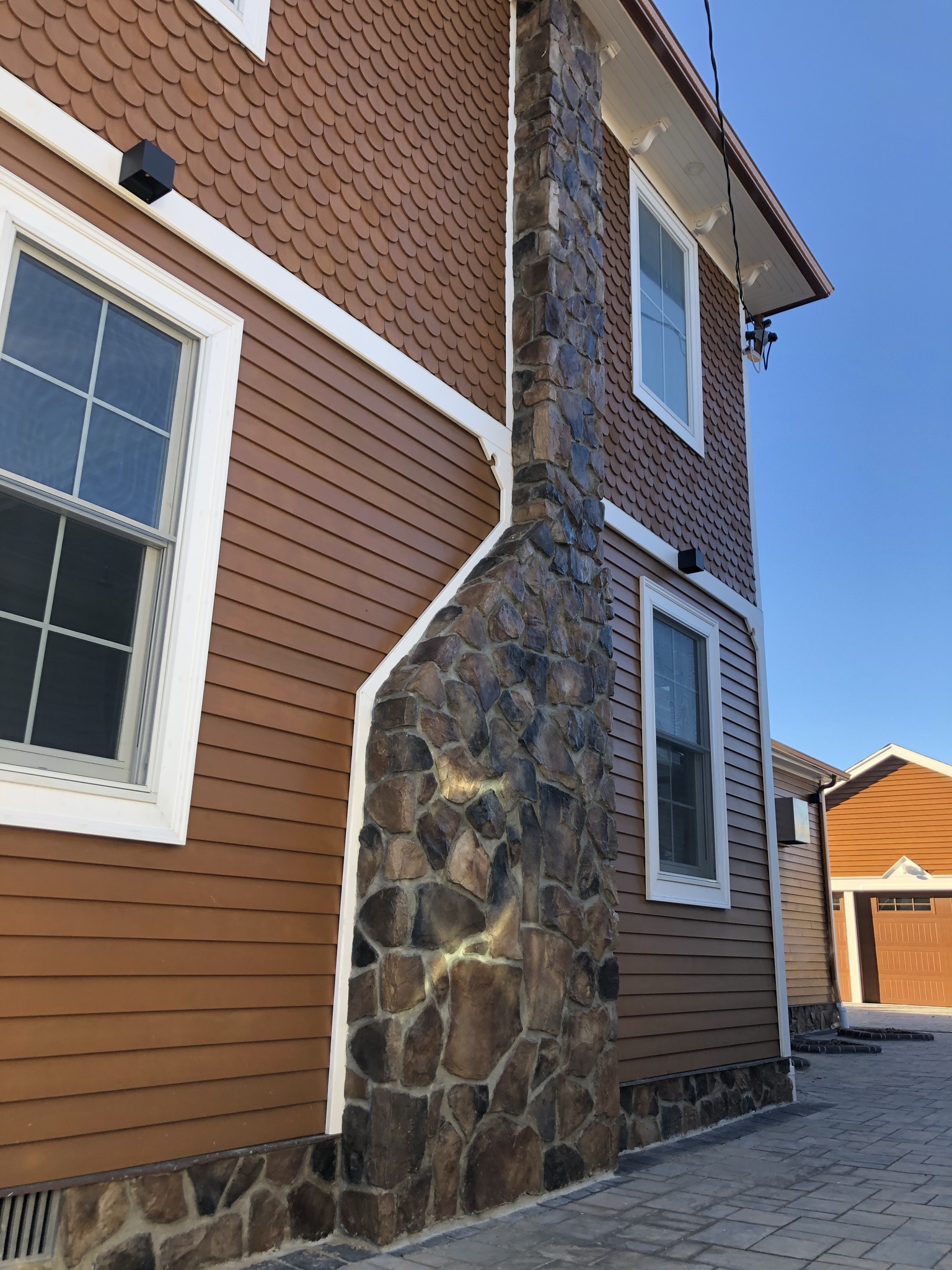Side of house with stone chimney