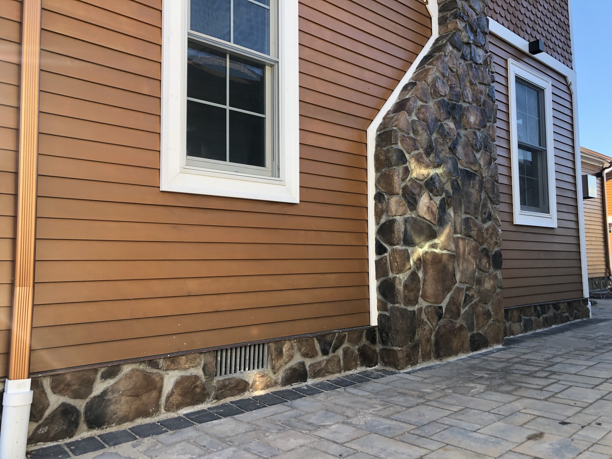 side of house with stone work